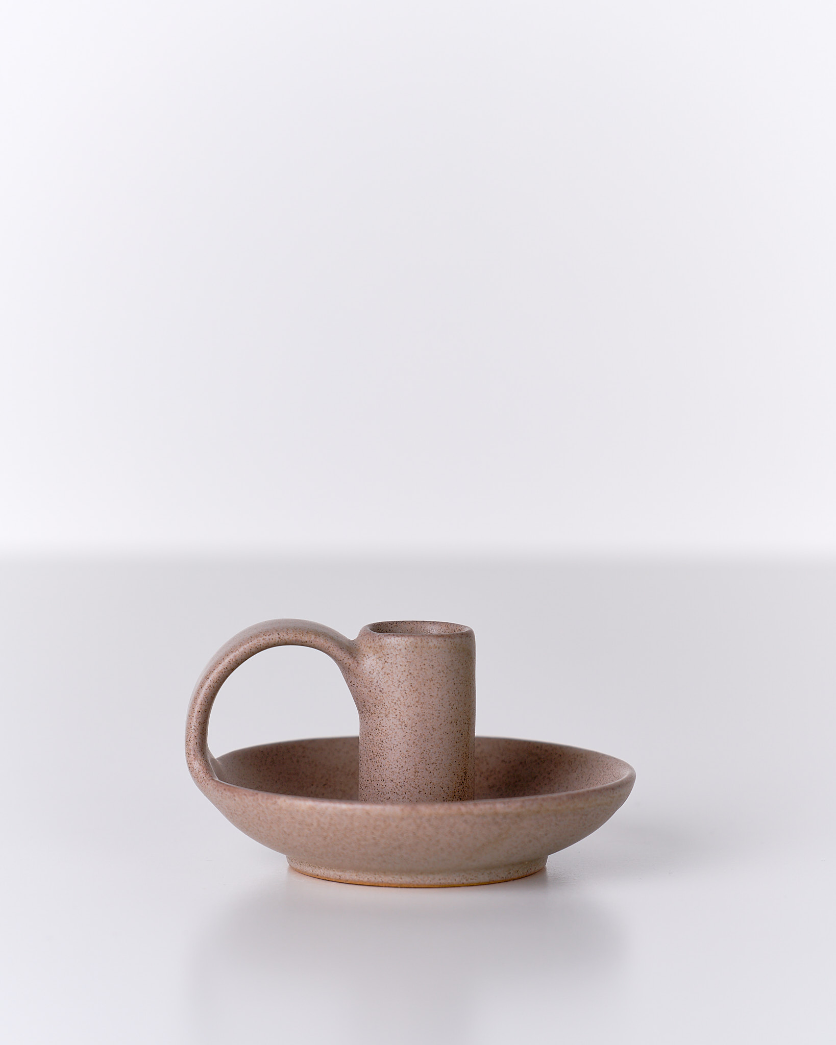 Porta candela in ceramica artigianale, finitura opaca e forme morbide, Terracotta Home Store.