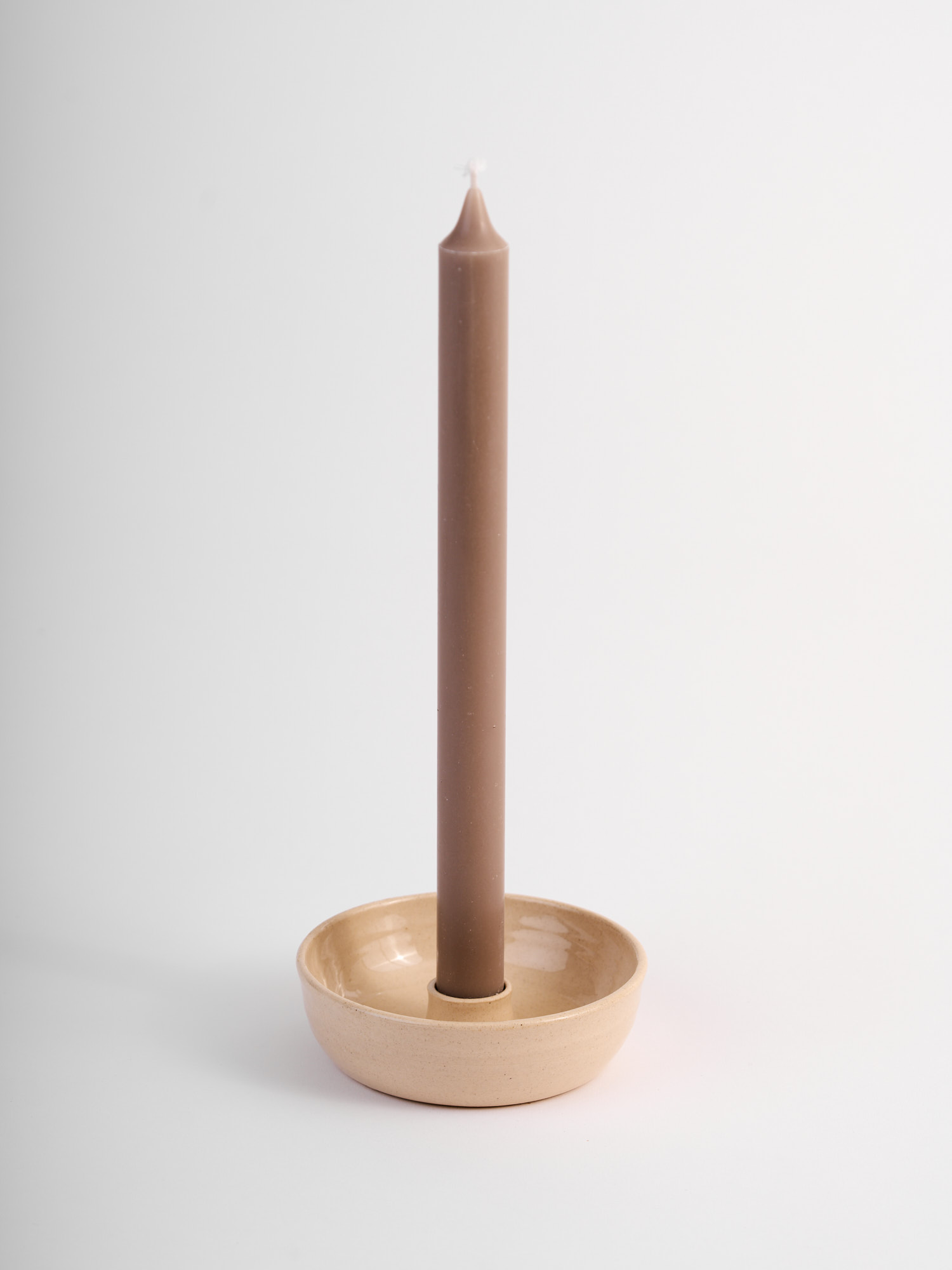 Candelabro in gres color burro con candela da tavola